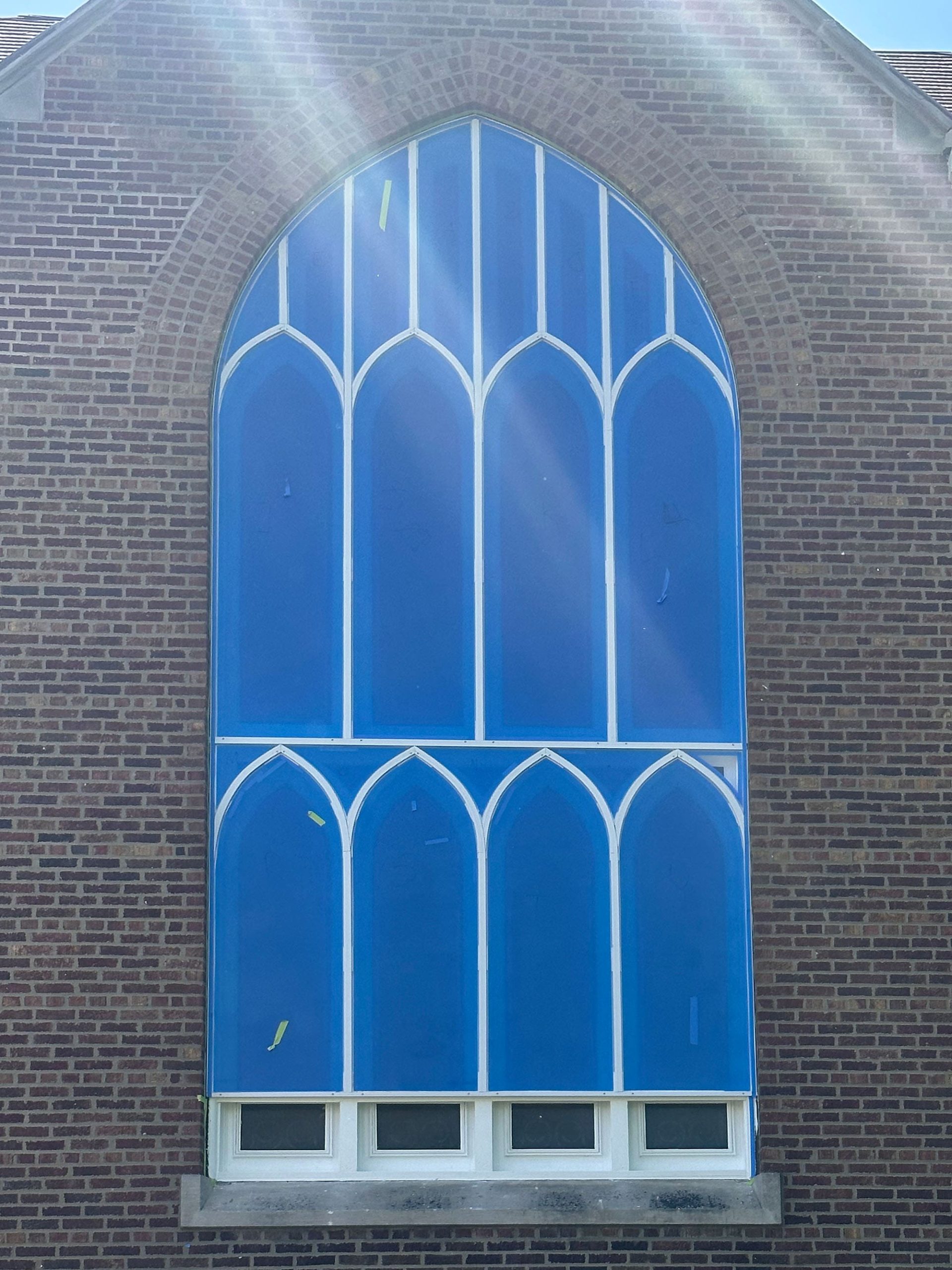 A protective covering over a stained glass window.
