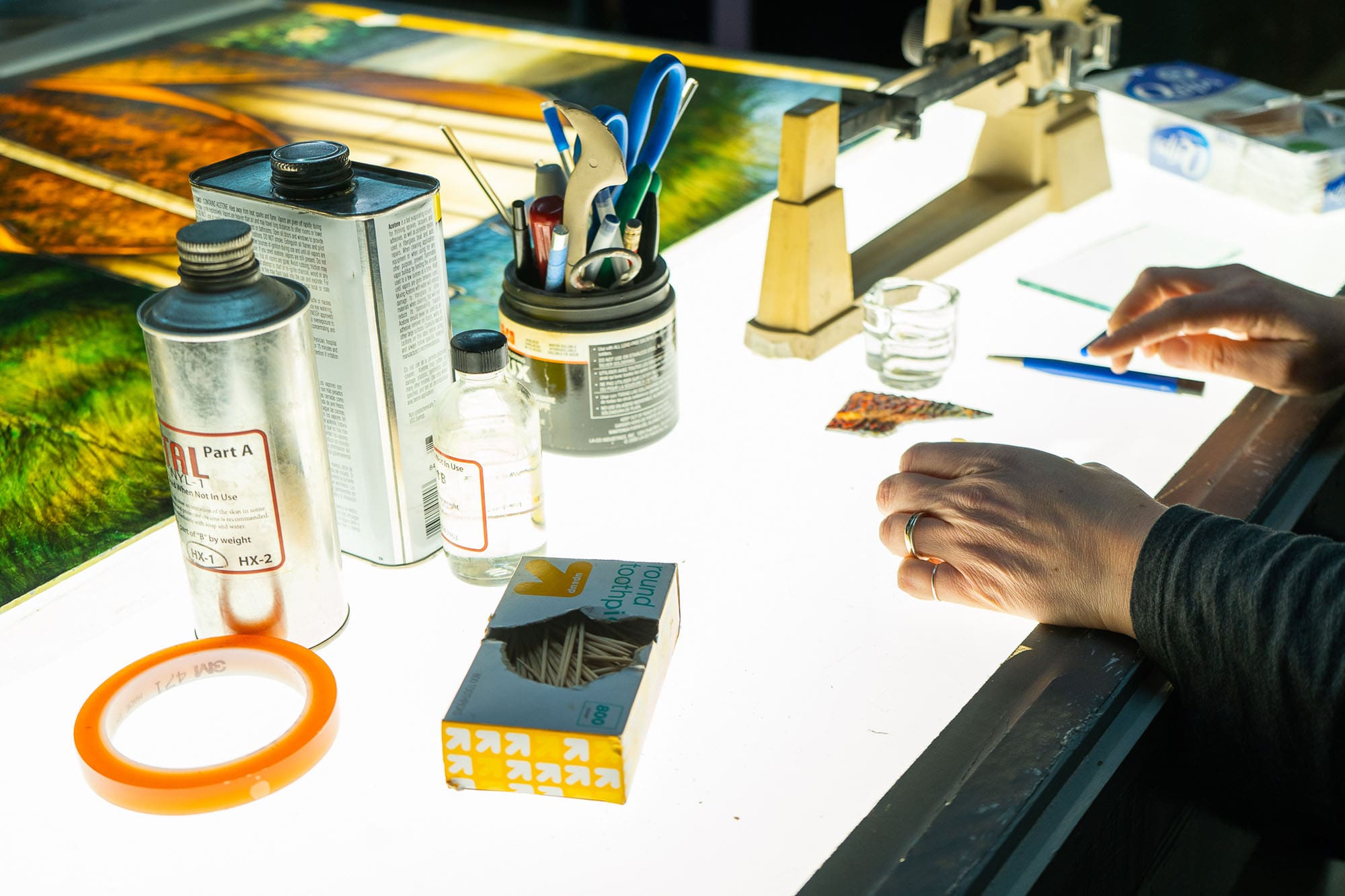 A craftsman repairs stained glass.