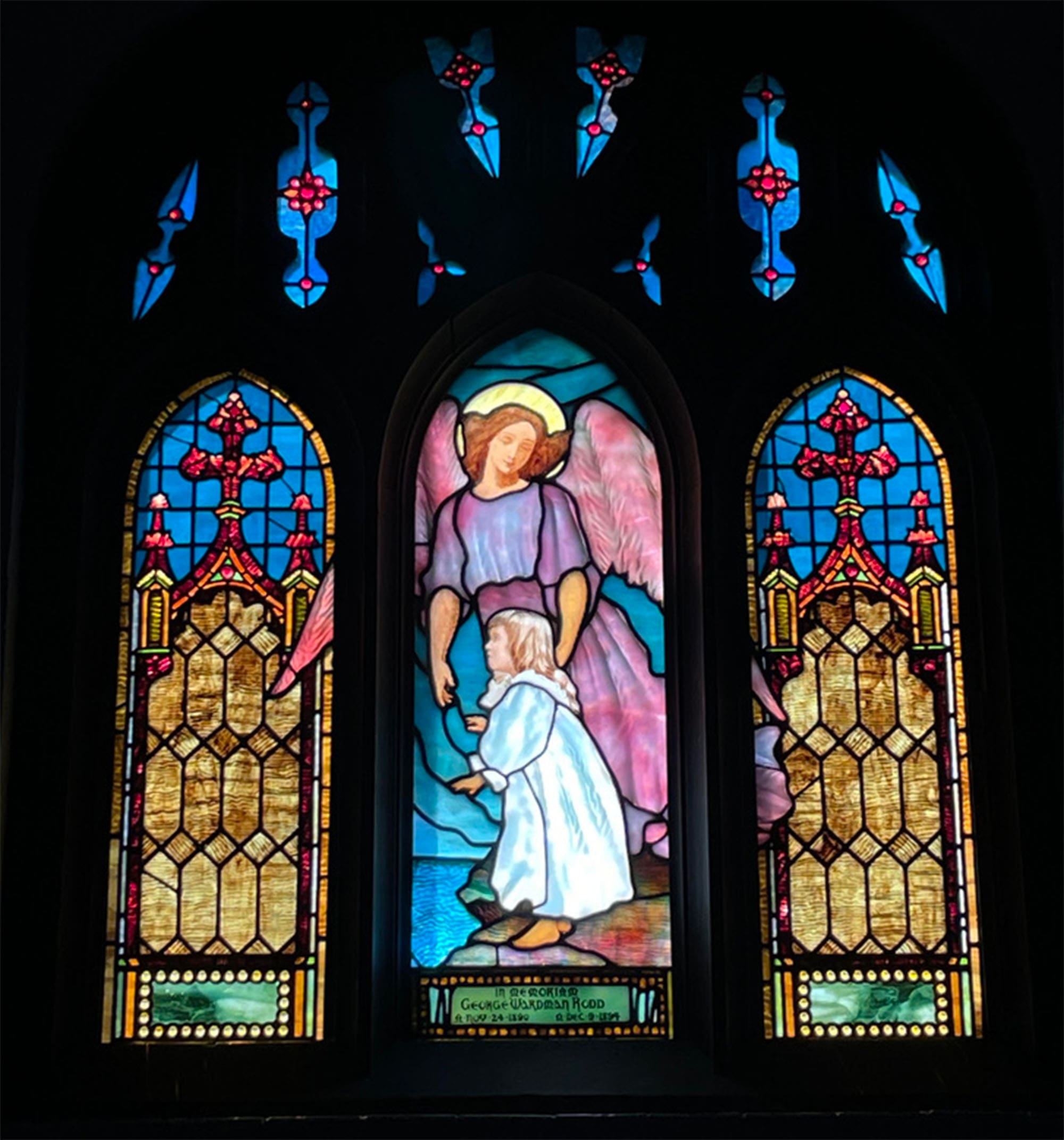 A stained glass window of an angel.