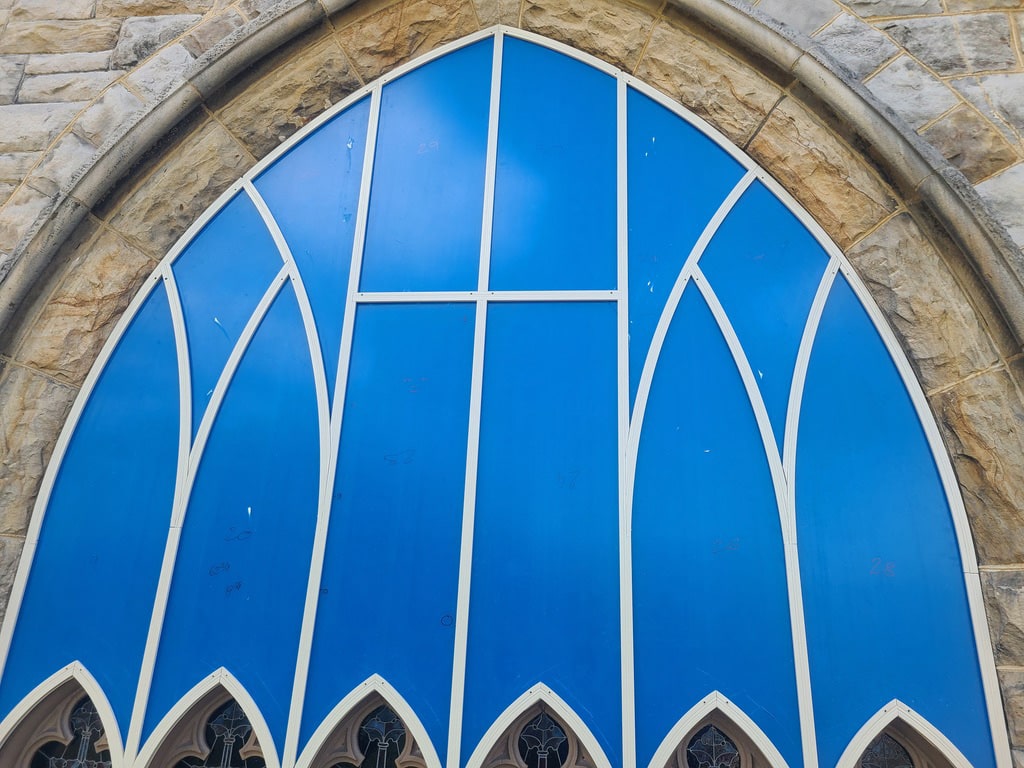 A protective covering over a stained glass window.