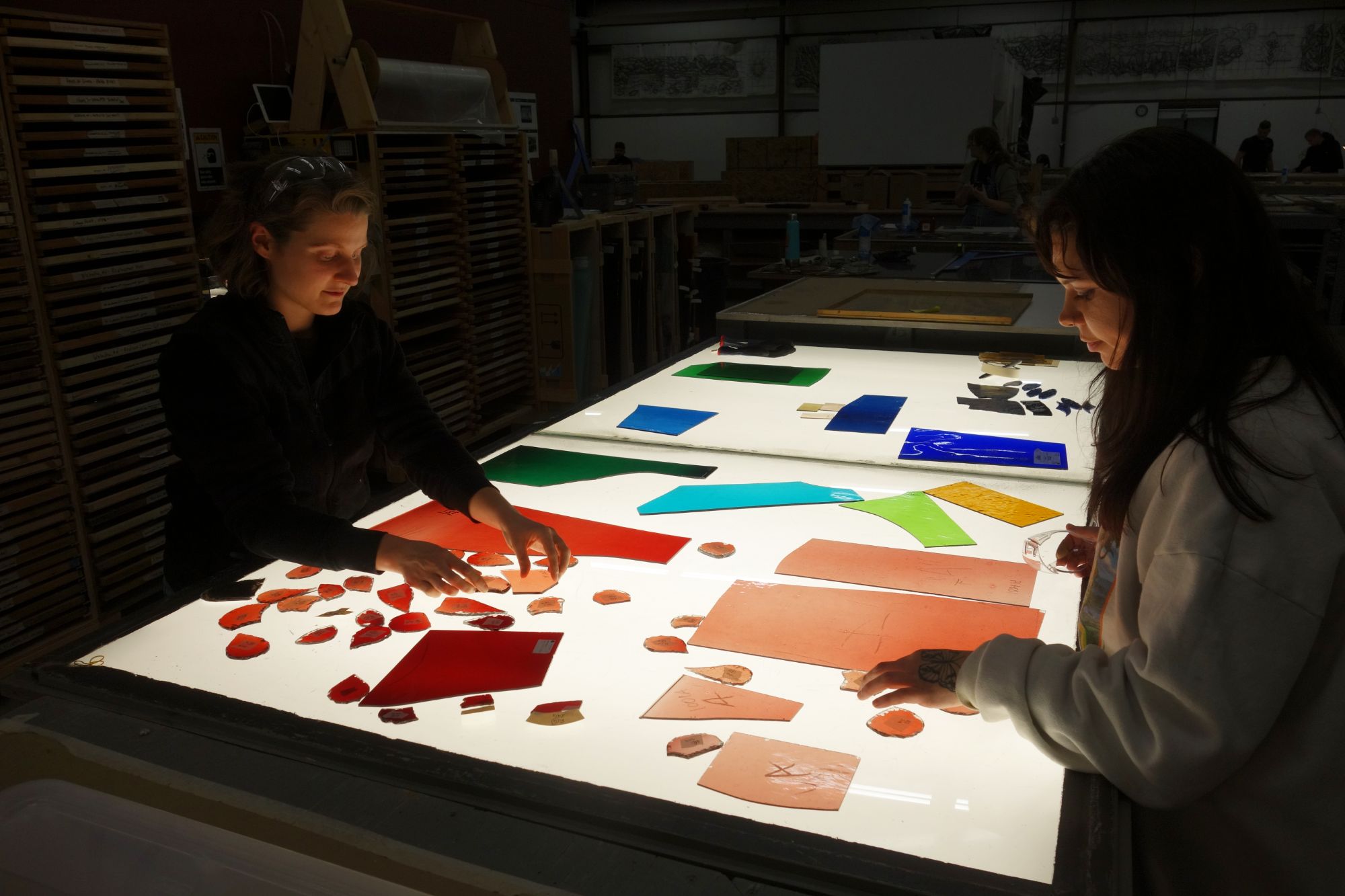 Willet employees work on stained glass restoration.
