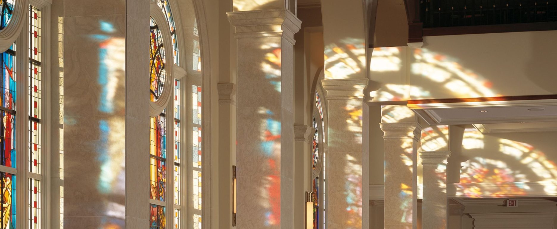 The interior of a church with beautiful stained glass windows.
