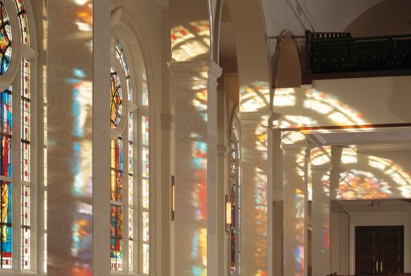 The interior of a church with beautiful stained glass windows.