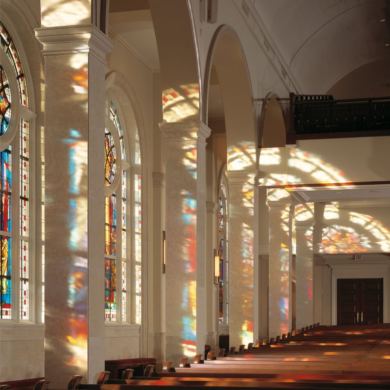 The interior of a church with beautiful stained glass windows.