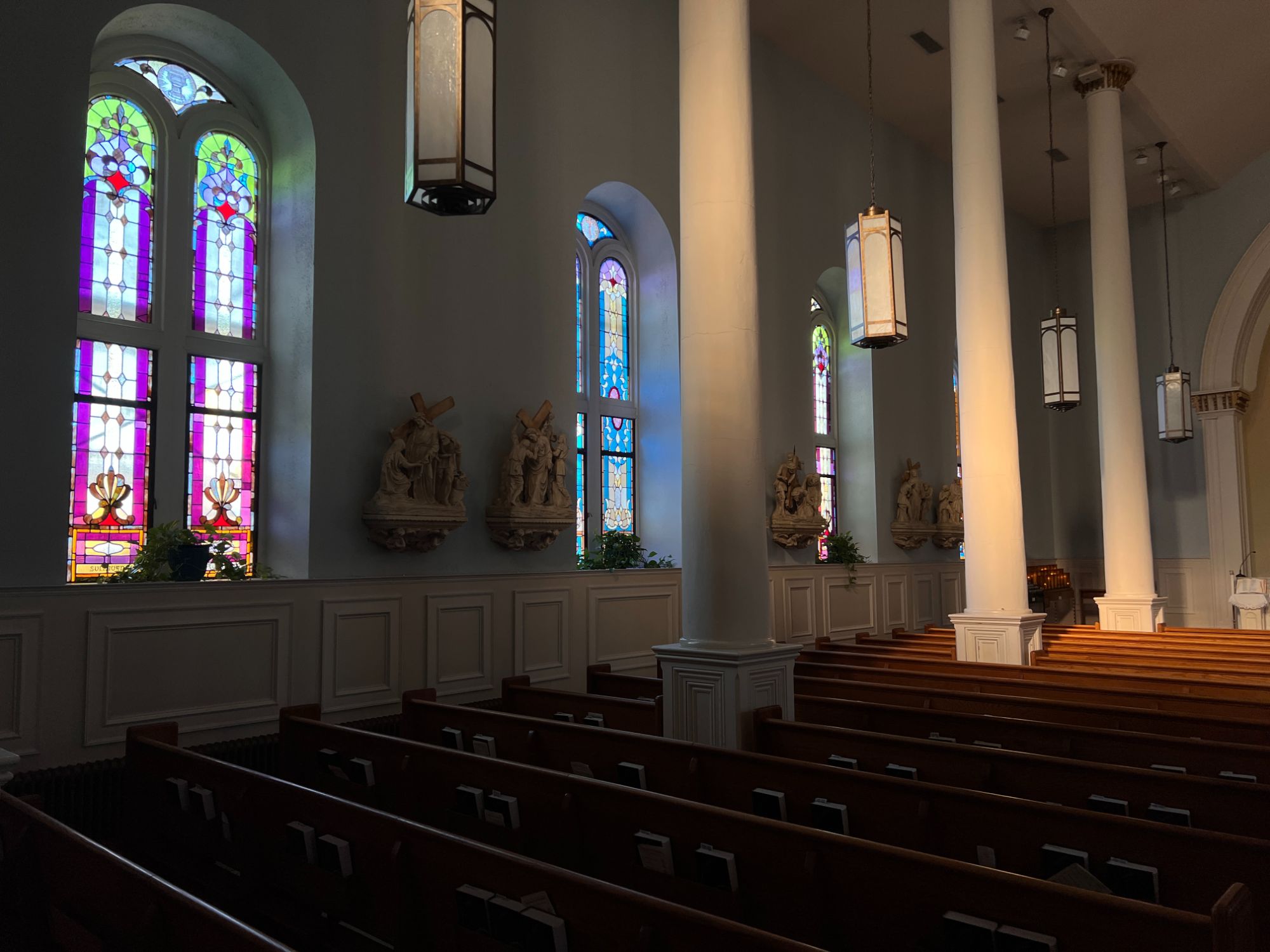 The interior of a church with beautiful stained glass windows.