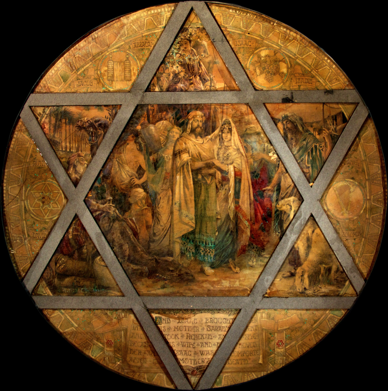 Stained glass artwork depicting the biblical figures Isaac and Rebecca within a star-shaped frame, showcasing intricate details and historical significance, representing Willet Stained Glass Studios' artistry and craftsmanship.
