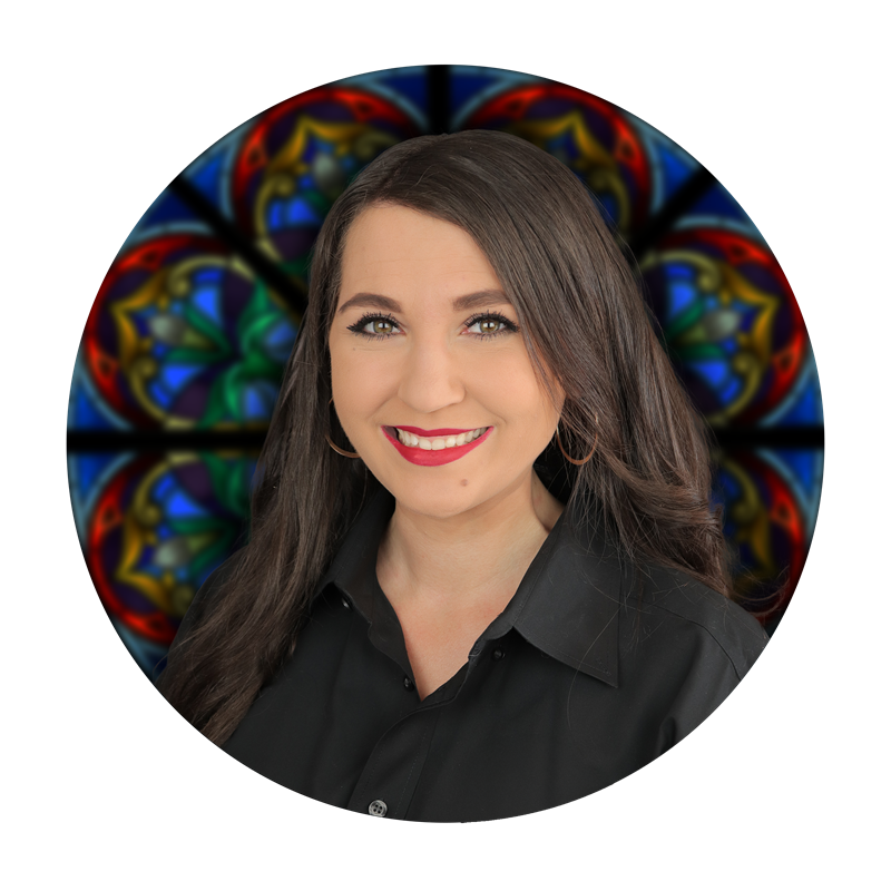 Amanda Steine, Marketing Manager at Willet Stained Glass Studios, with stained glass background.