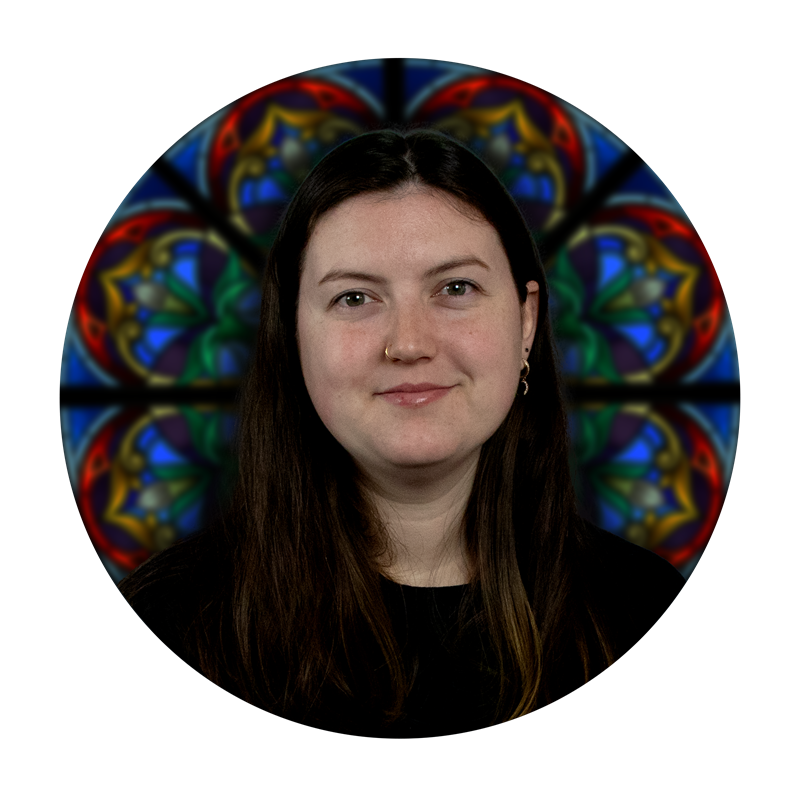 Emilie Tousignant, Design Assistant at Willet Stained Glass Studios, with a stained glass background featuring intricate designs in vibrant colors.