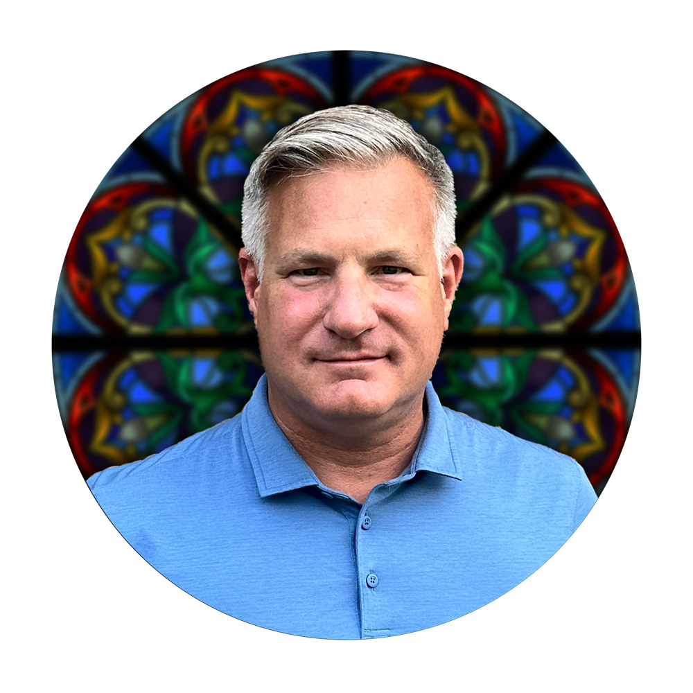 Kevin Kennedy, VP of On-Site Operations at Willet Stained Glass Studios, against a colorful stained glass background.