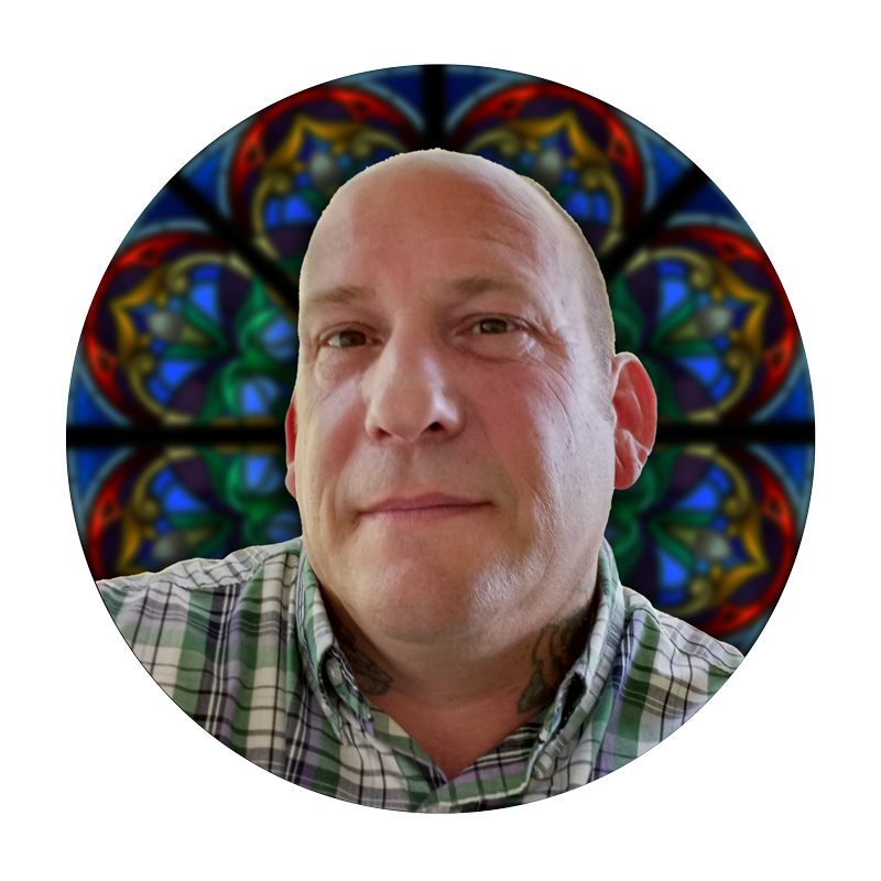 Darren Belcher, Project Manager at Willet Stained Glass Studios, with stained glass design background.