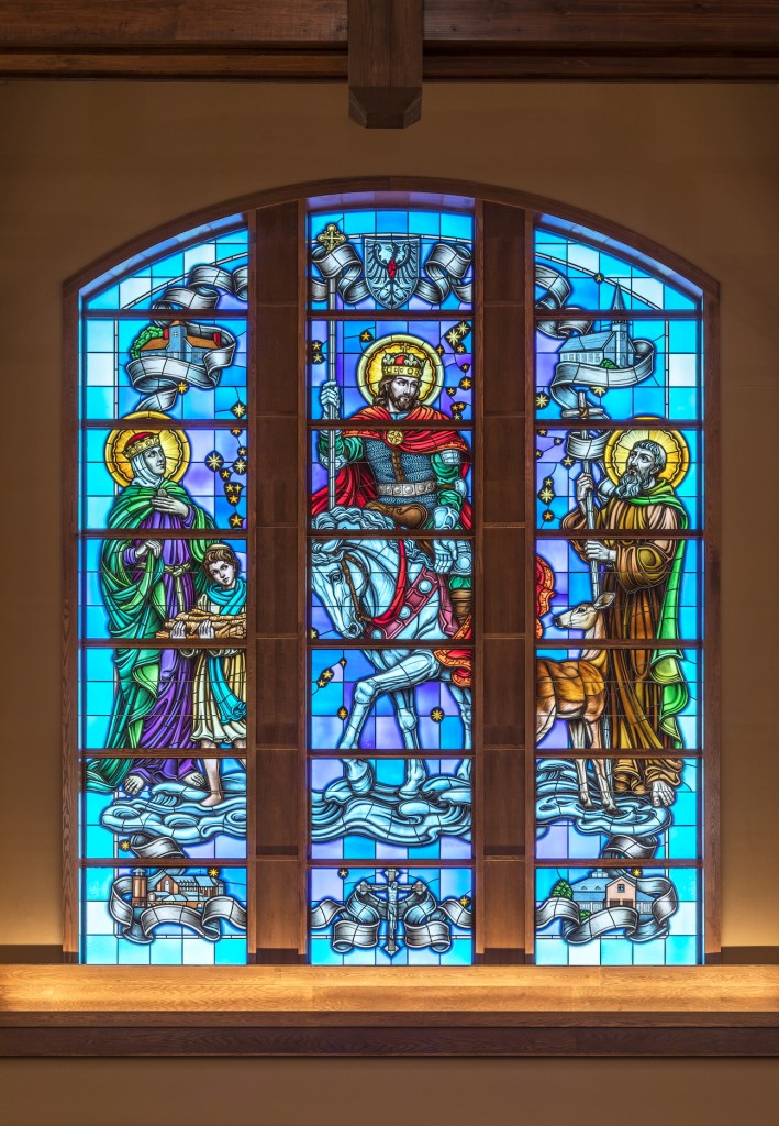Detailed stained glass window depicting saints and religious figures, Willet Studios craftsmanship.